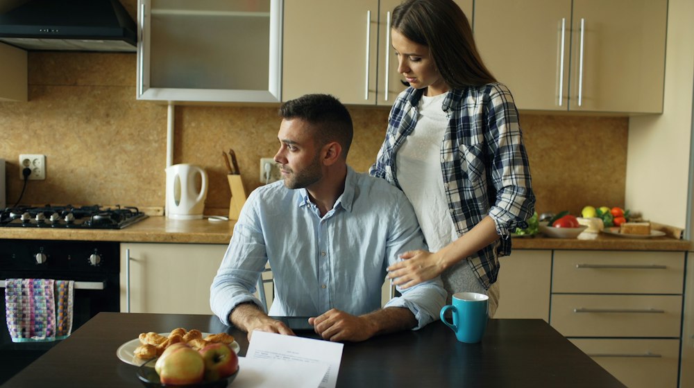 Two small-business owners standing together