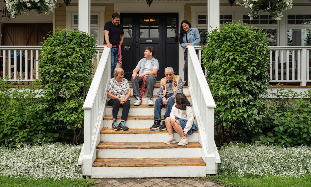 A family at the door of their new home